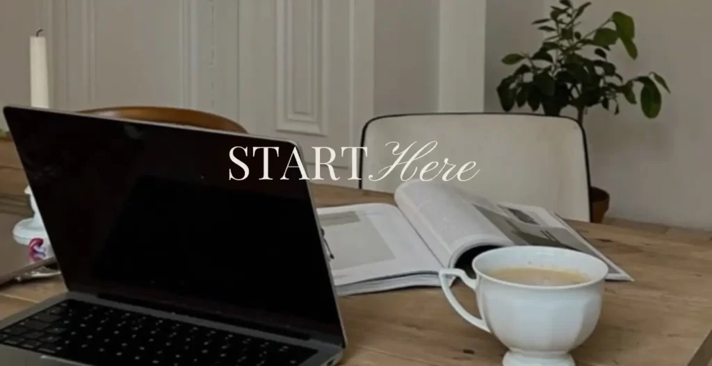Laptop, open book, coffee cup on wooden desk; Digital Wealth Academy module.